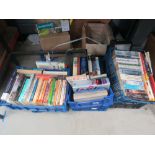 6 boxes containing a large quantity of paperback novels