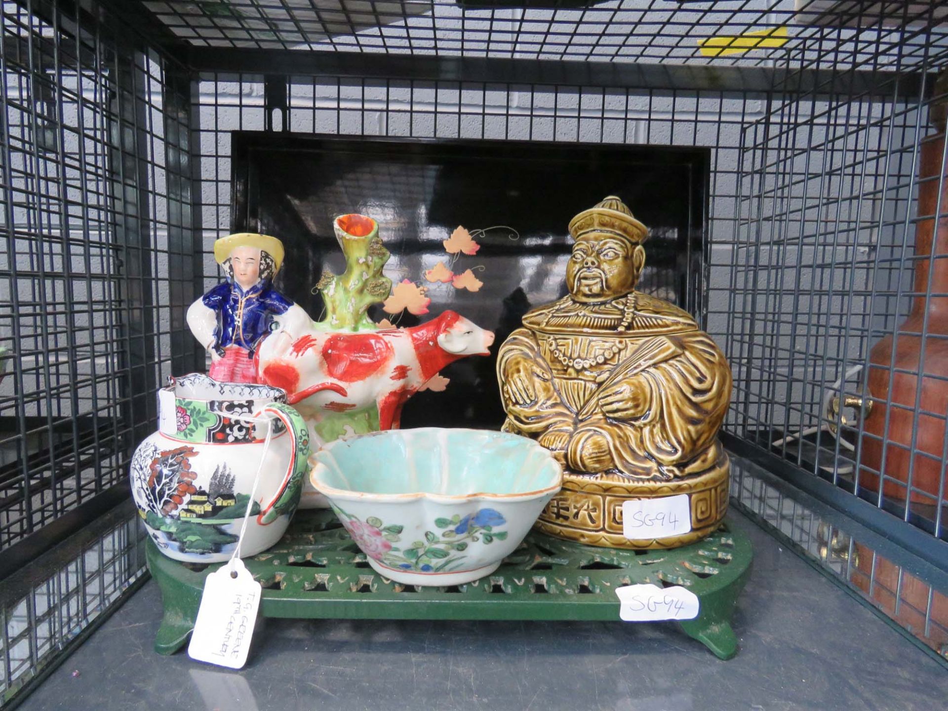 Cage containing a lacquered tray, Staffordshire figure, Chinese bowl, milk jug and a Chinese figure