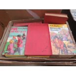 Box containing Enid Blyton novels