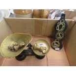 Box containing horse brasses and a set of kitchen scales with weights