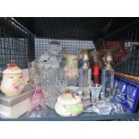 Cage containing shot glasses, decanter, candlesticks, soda siphon and china