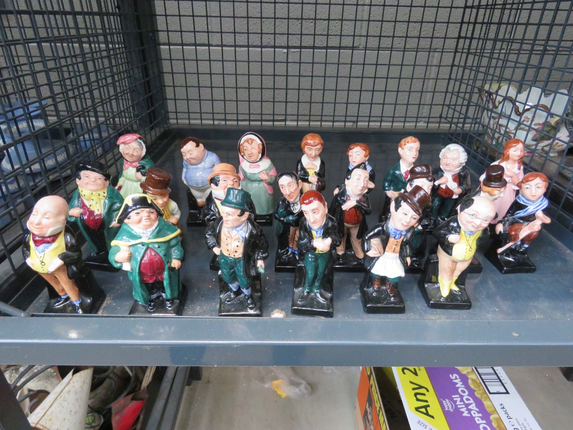 Cage containing a quantity of Royal Doulton Dickens characters