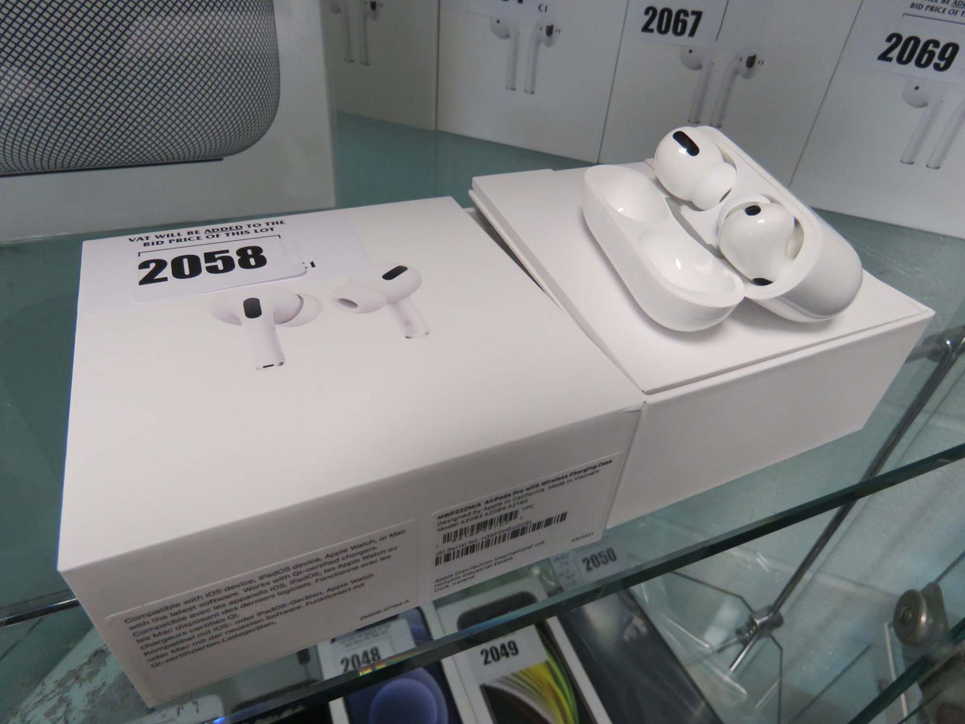 Apple AirPods Pro with wireless charging case and box