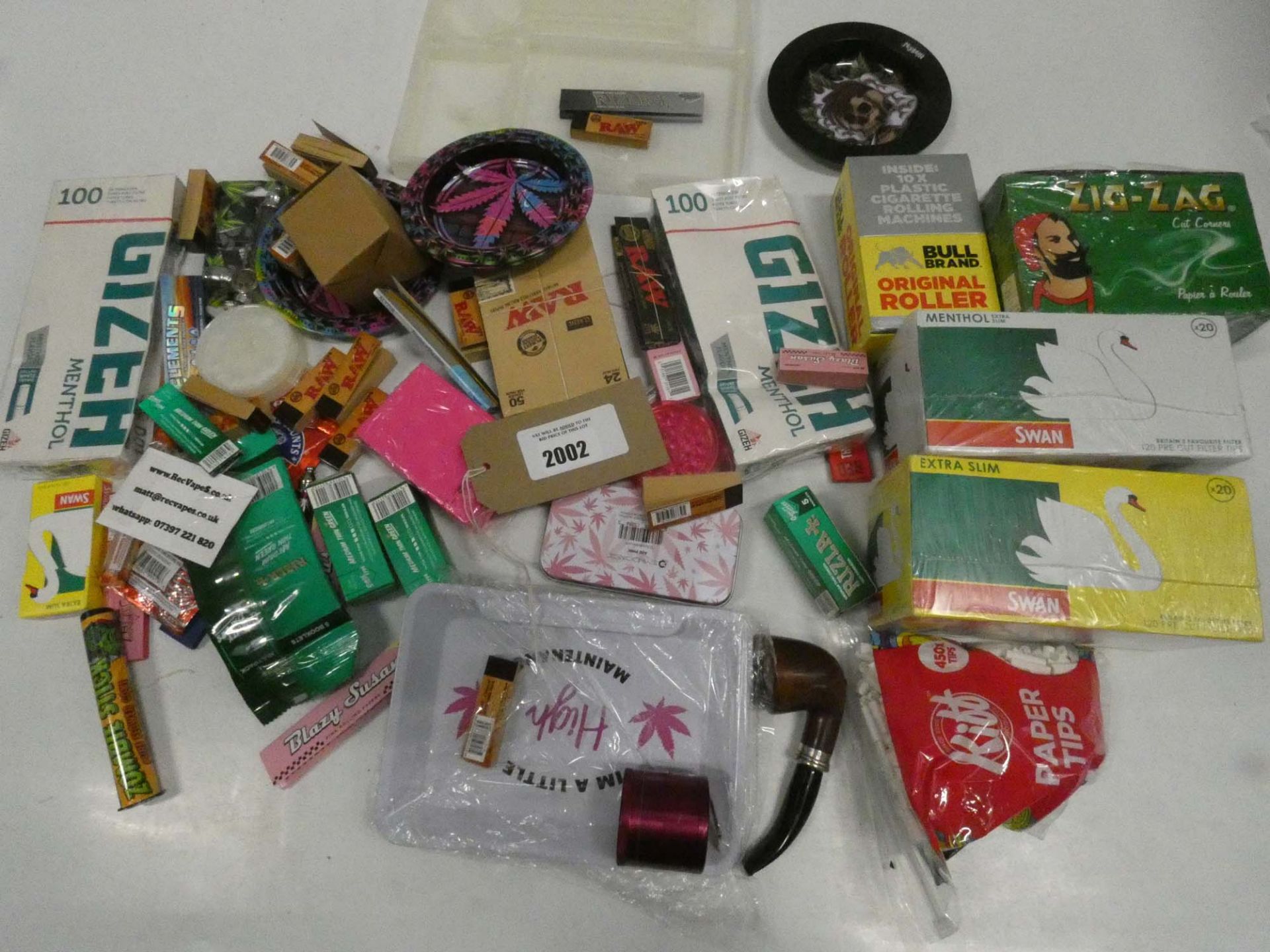 Bag containing various smoking accessories; filters, trays, card tips, papers etc