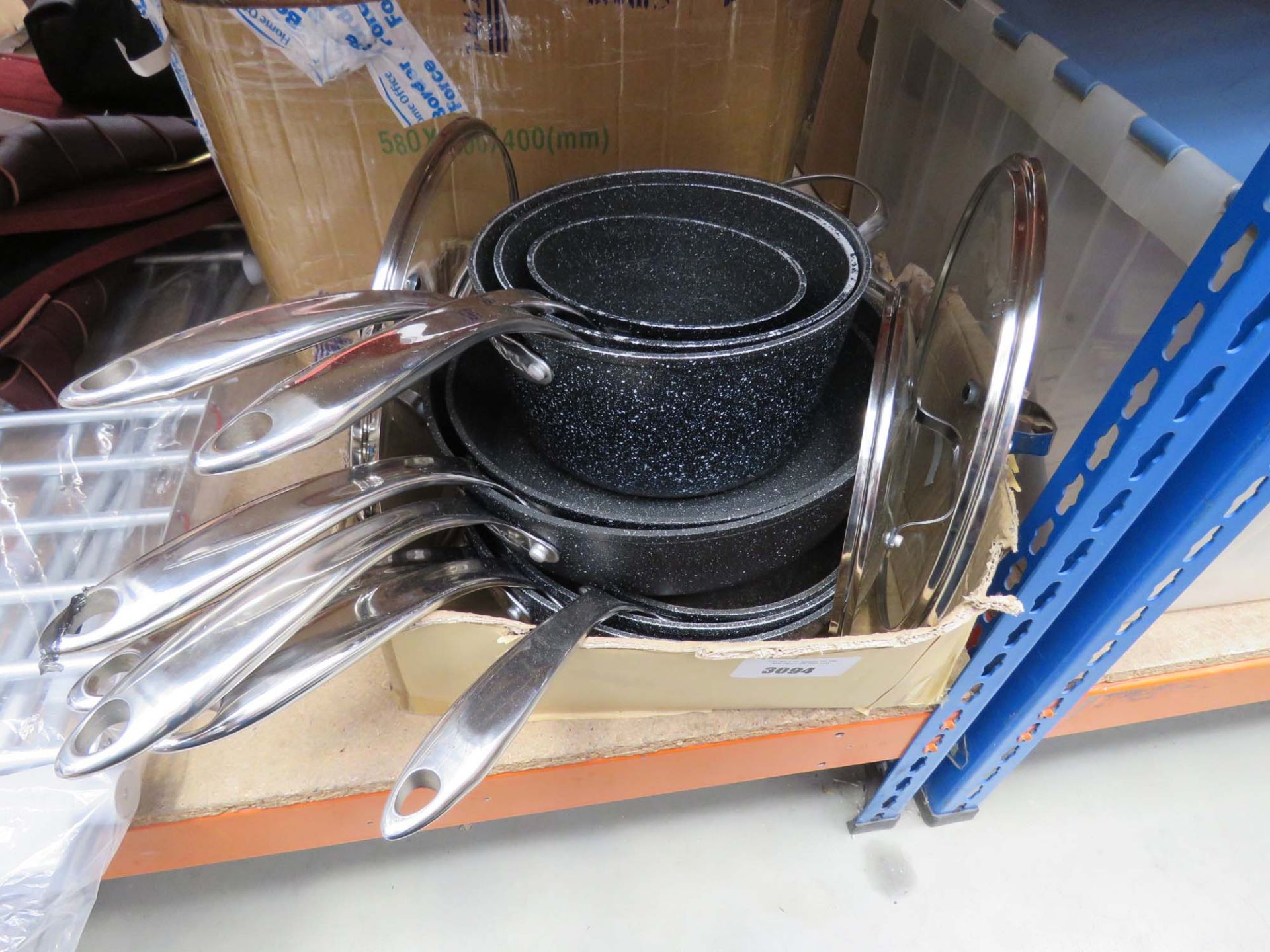 Box containing used Star For It Rocks pots and pans