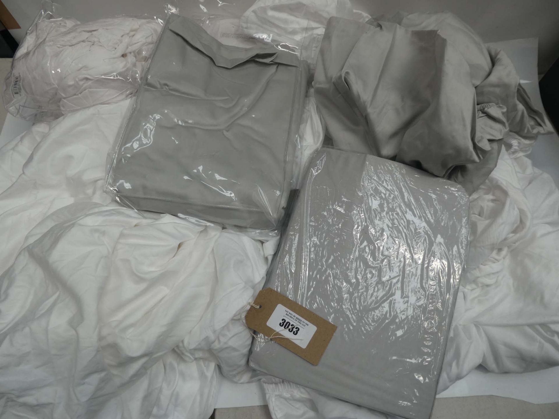 Bag of bedding sheets in grey and white