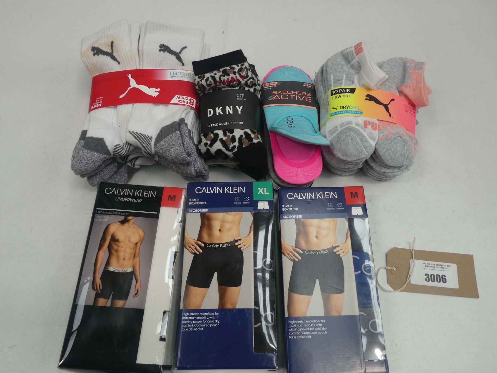 Bag of Calvin Klein underwear and mixed paired socks to include DKNY, Puma and Sketchers