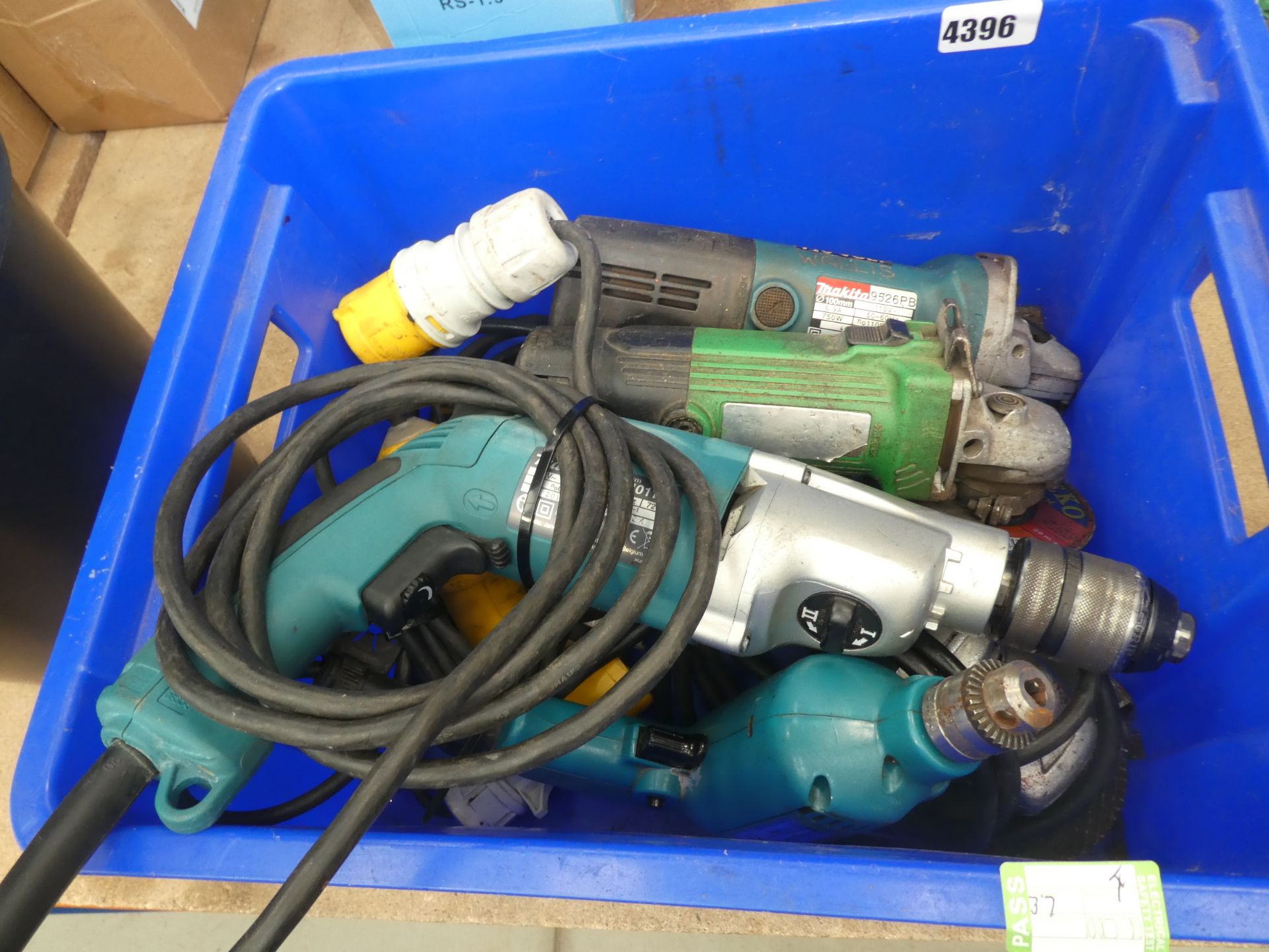 Blue box containing 110v drills and angle grinders
