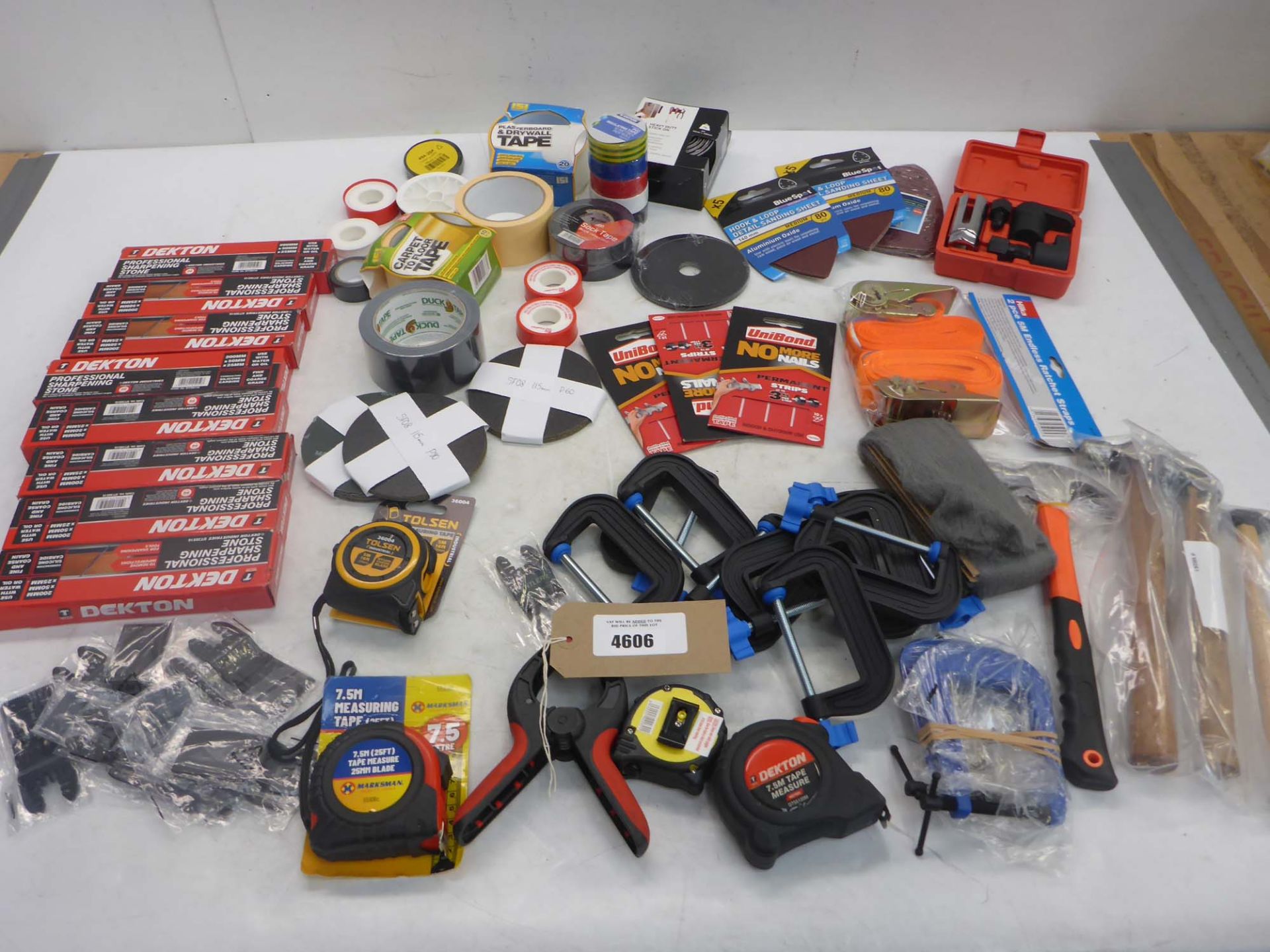 Sharpening stones, multi tool blades, tape measures, adhesive tape, sanding pads, G-clamps, hammers,
