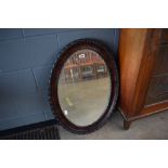 Oval darkwood surround mirror