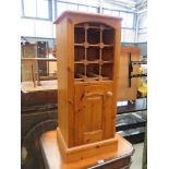 Pine single door pot cupboard with wine rack over