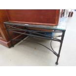 Metal framed coffee table with glazed top