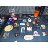 Cage containing assorted items to include rubber spiders, fridge magnets, etc