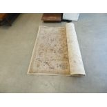 Carpet in beige geometric and floral design