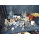 Cage containing assorted items to include collectable cottage figurines, decanters, decanter