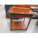 Occasional table in mahogany with barleytwist supports with single shelf under