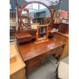 Mahogany dressing table of two over two drawers with oval mirror