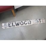 Wooden street sign of Belwood street