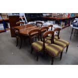 Mahogany dining room extending table on fluted legs with 8 shieldback chairs with striped fabric