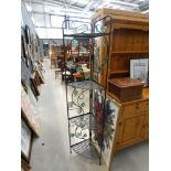 Four tier corner shelving unit with floral relief in metal