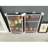Three advertising posters in black frames entitled ''Louis Vuitton'', ''Gucci'' and ''Cartier''