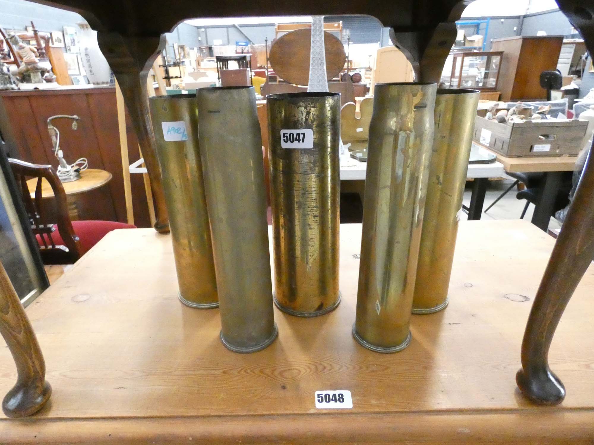 (5) Five shell cases