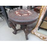 Far Eastern carved top table on elephant head supports