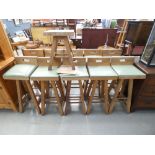 Ten oak based bar stools with green rexine seat and one matching low stool