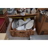 Picnic hamper containing a quantity of white fine porcelain china to include teacups, gravy boats
