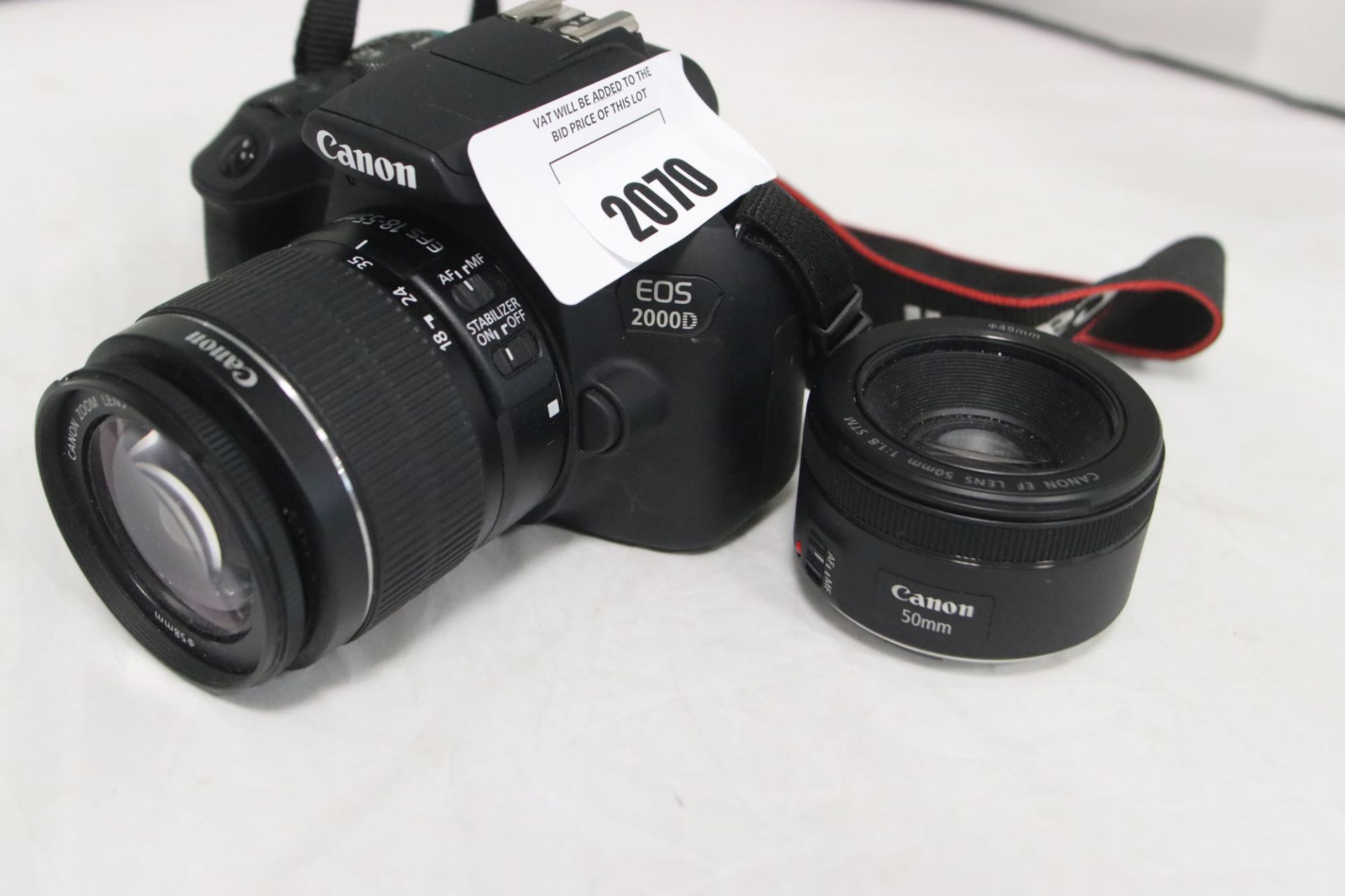 Canon EOS-2000D DSLR camera with EFS 18-55mm lens, EF50mm lens and battery charger