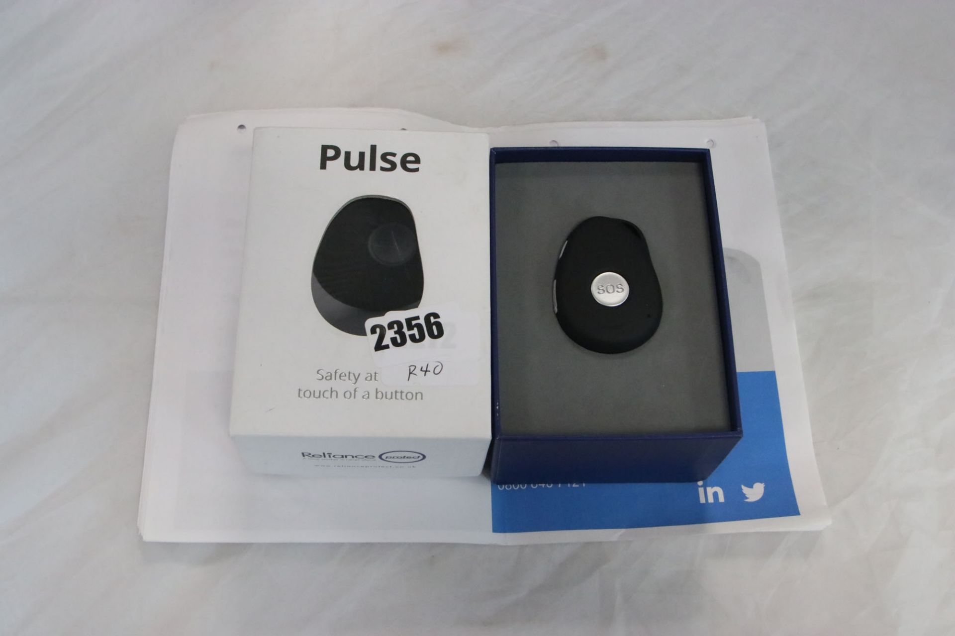 2272 - Pulse Safety SOS device together with manual and accessories boxed