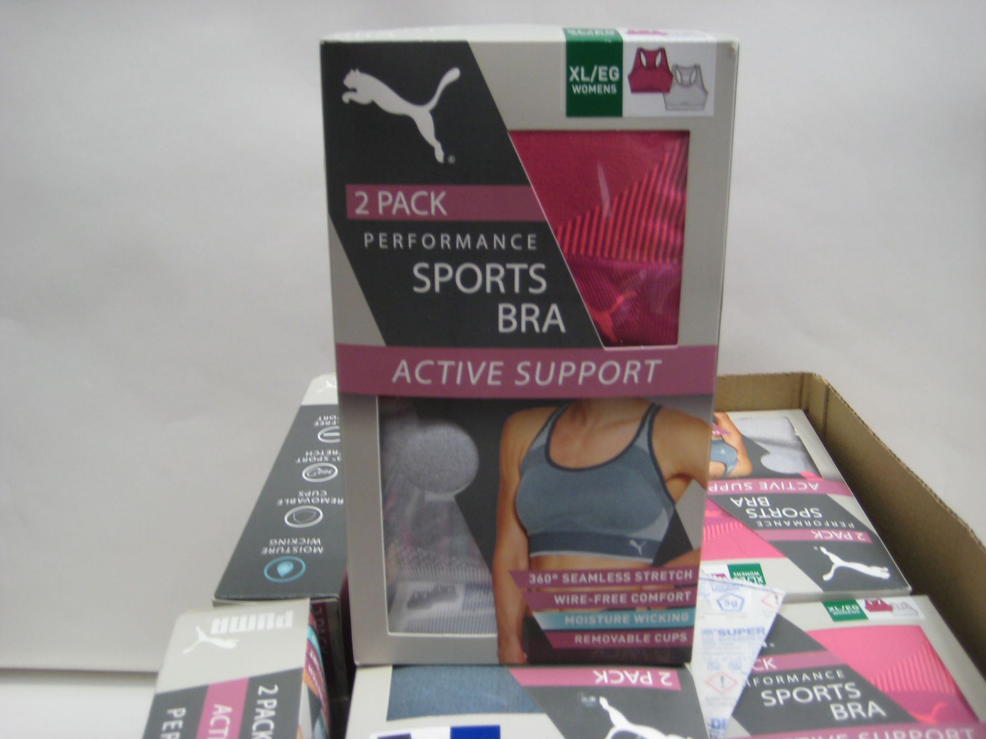 Box containing approx 34 boxed twin pack Puma sports bras various sizes