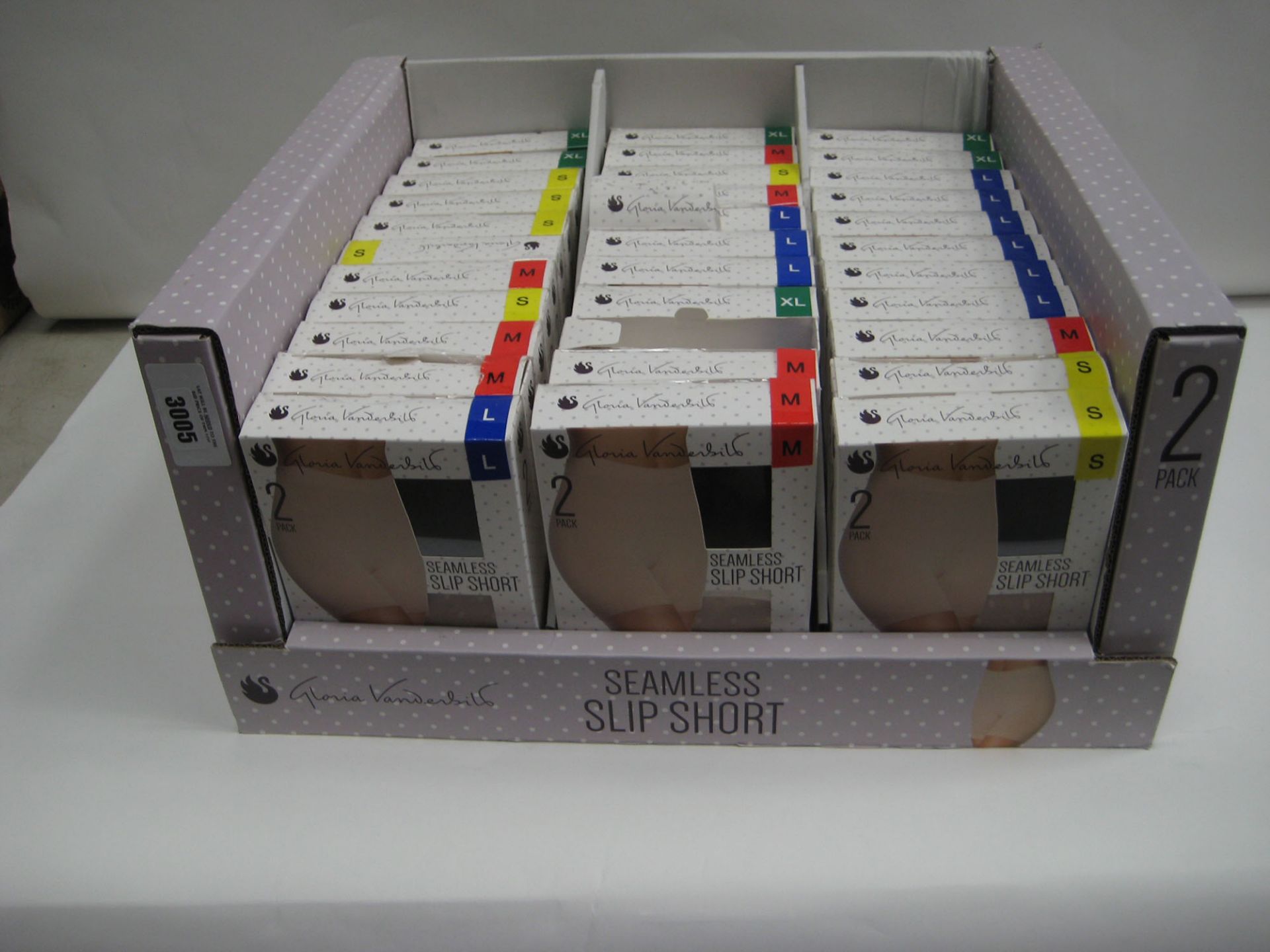 Box containing a qty of seamless slip shorts by Loreal Vanderbilt sizes S to XL