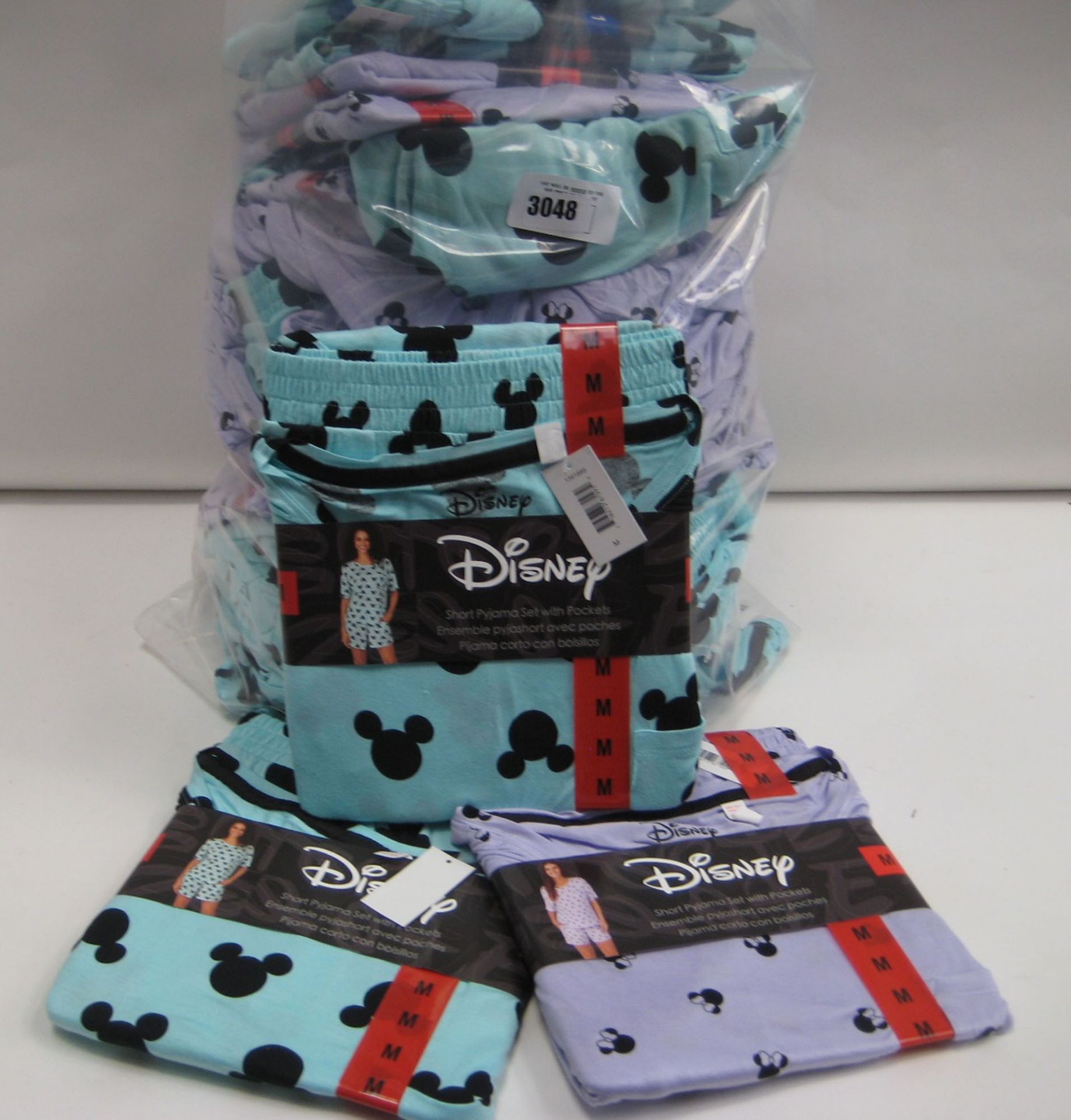 Bag containing Disney short PJ sets with pockets sizes M - L colours to inc. light green, turquoise,