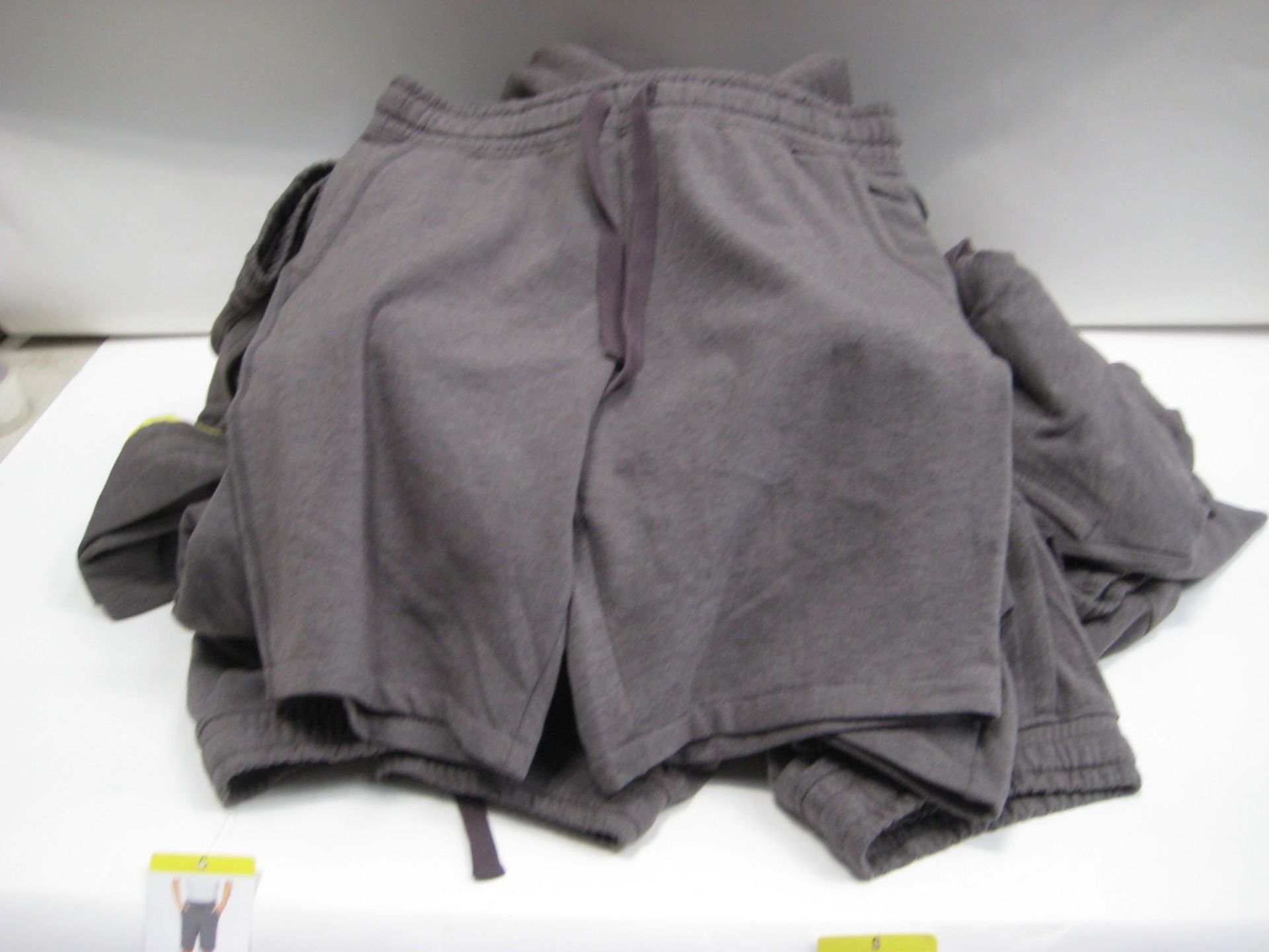 Bag containing approx 25 original Jacks manufacturing company sports shorts in grey