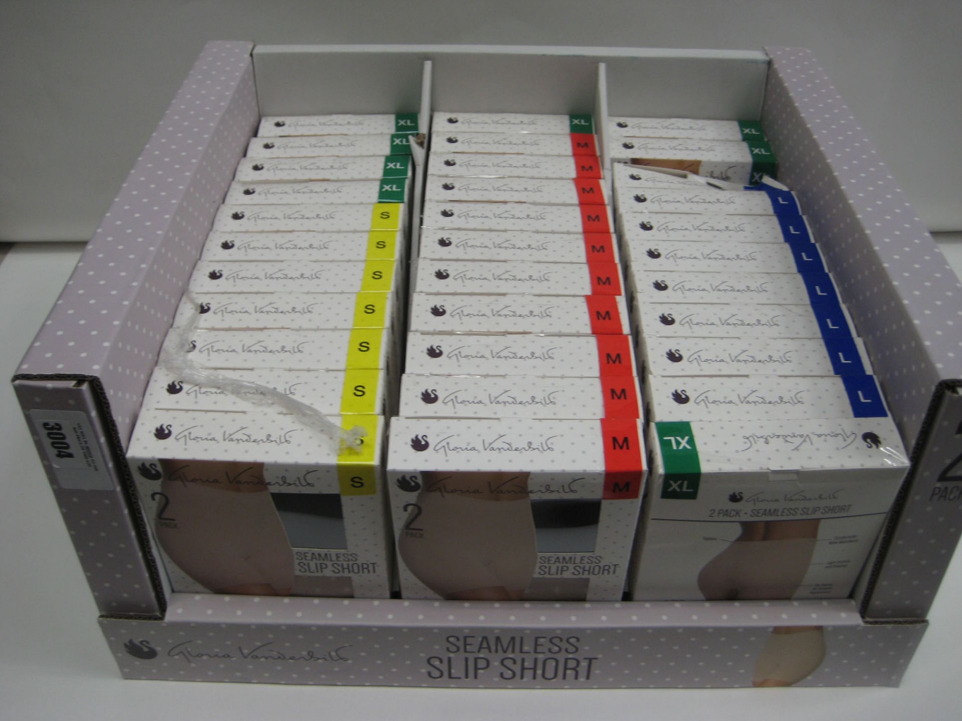 Box containing a qty of seamless slip shorts by Loreal Vanderbilt sizes S to XL