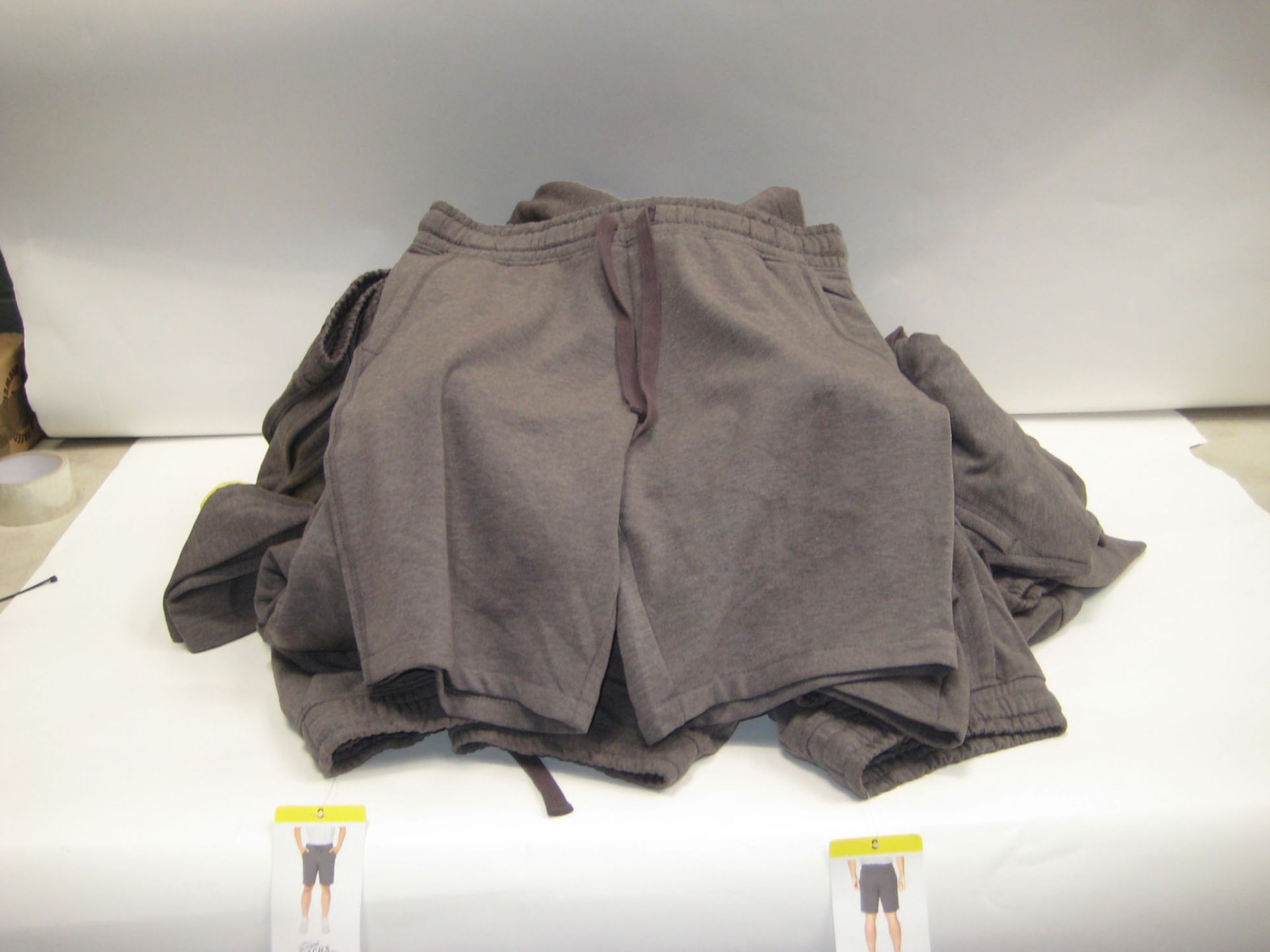 Bag containing approx 25 original Jacks manufacturing company sports shorts in grey