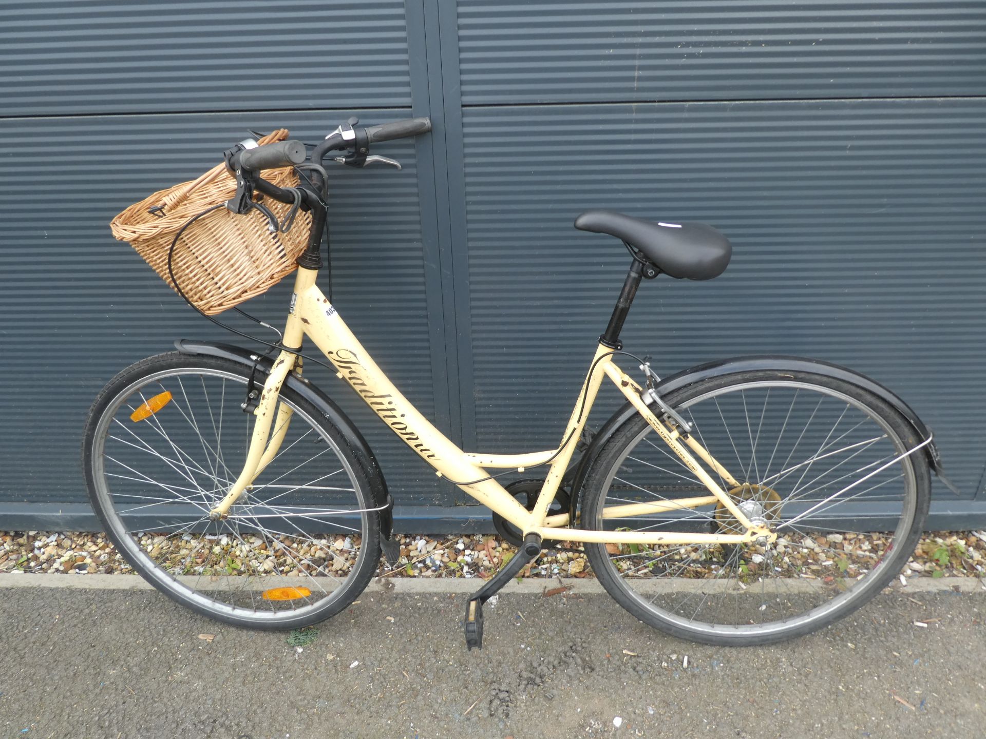 Traditional step through bike in cream with shopping basket