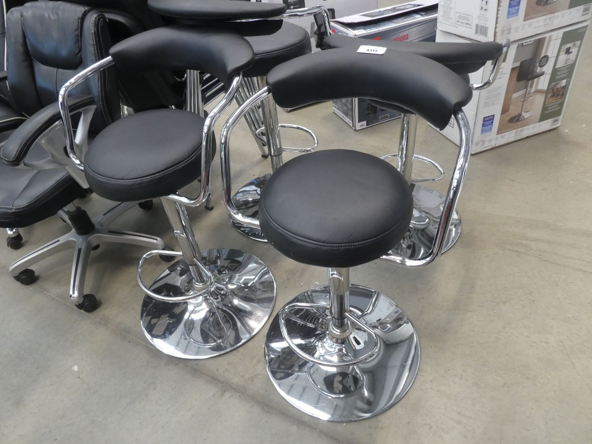 4 chrome based black top swivel barstools