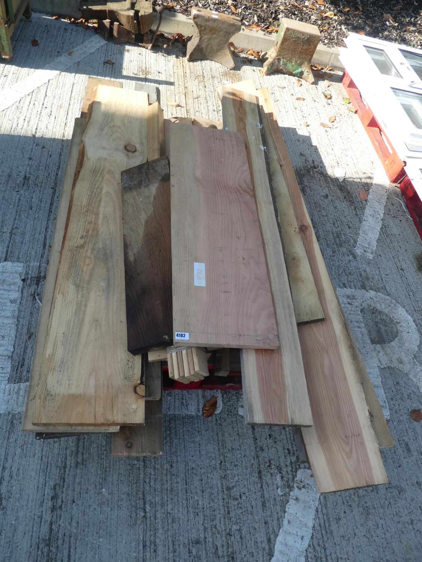 Pallet of assorted waney edge and board timbers
