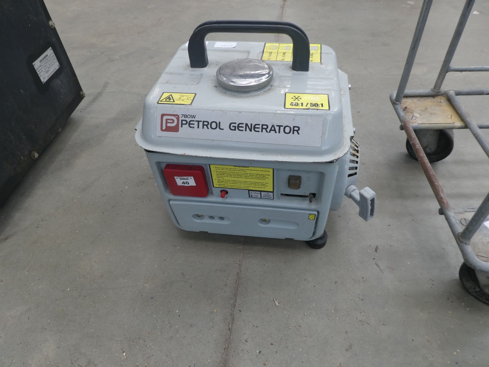 Small grey petrol powered generator