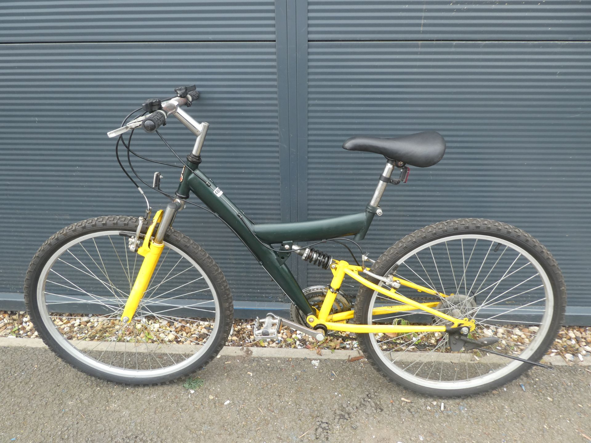 Full suspension mountain bike in yellow and green