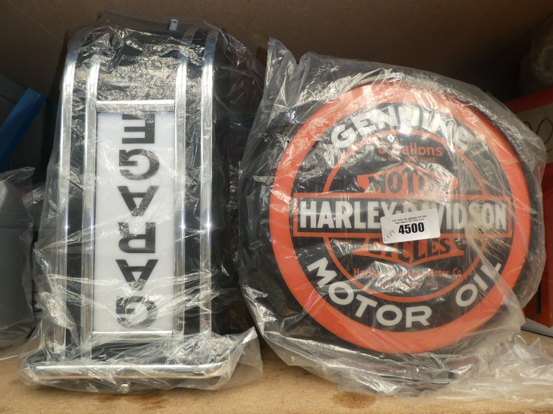 Harley Davidson motor oil sign and a garage sign