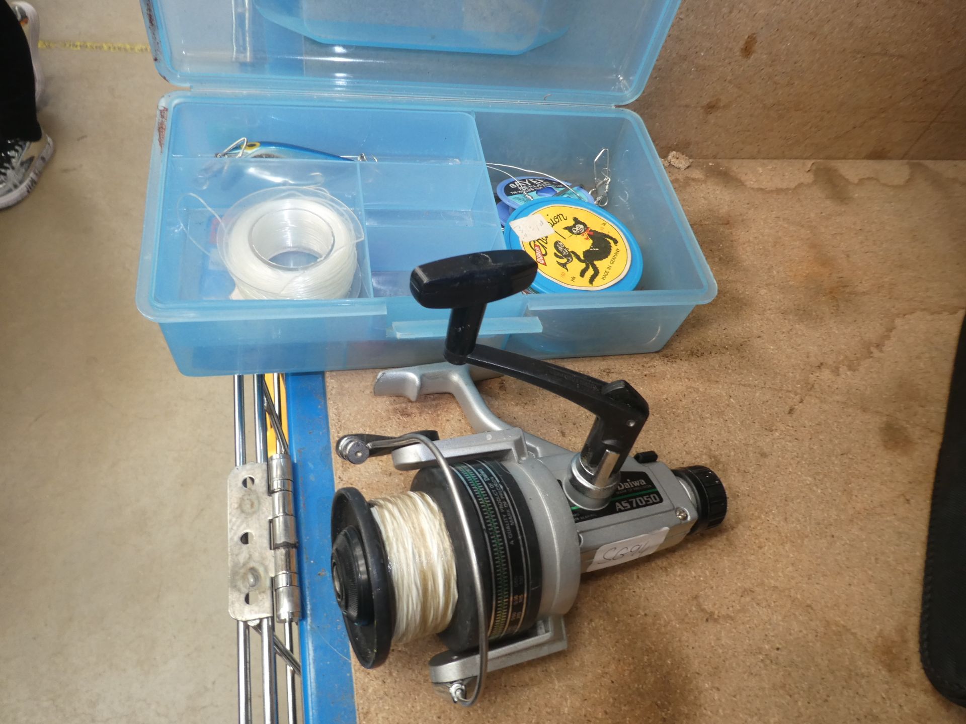 Daiwa fishing reel and a small box