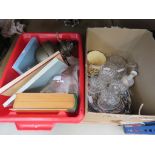 Two boxes containing an oil lamp, book storage, glassware, ceramics, cloths, Shakespeare plates,