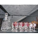 Cage containing decanters and decorative glass vases