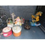 Cage of musical globes, decorative carousel horse, etc