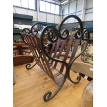 Wrought iron and leather magazine rack