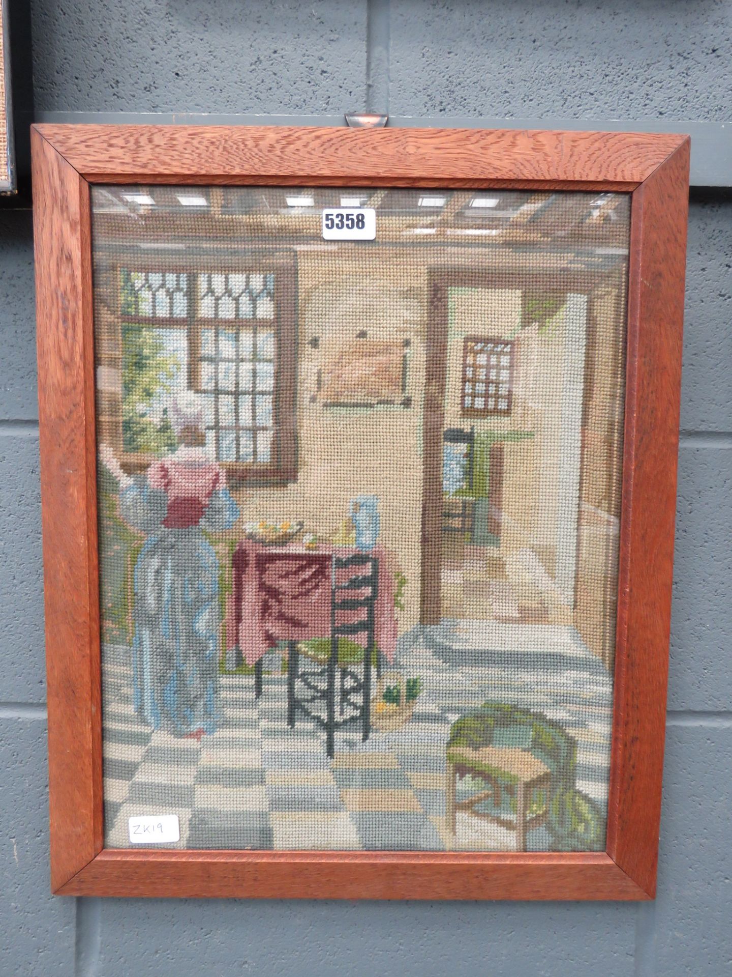 Oak framed embroidery of interior scene