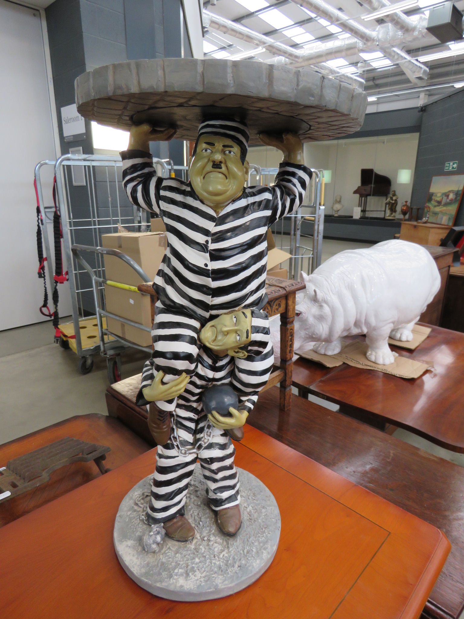 Reproduction table modelled as Laurel and Hardy in prison garb